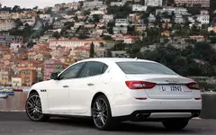 2014-Maserati-Quattroporte-rear-left-side-view-3.webp