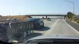 tesla-model-x-spotted-while-towing-a-dump-trailer-testing-its-10000-pounds-towing-capacity_2.webp