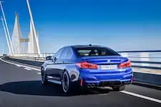 2018-BMW-M5-rear-three-quarter-in-motion-12.webp