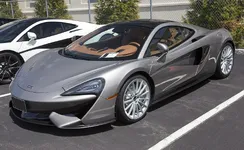 1200px-2017_McLaren_570GT%2C_Blade_Silver%2C_front_left.webp