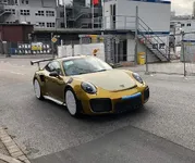 explosive-gold-porsche-911-gt2-rs-has-97000-chromaflair-paint_1.webp