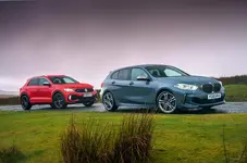 7_vw_t-roc_r_and_bmw_m135i_stationary_side.webp