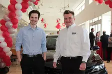 Jr.-with-Client-Advisor-Sam-McGee-of-Holman-Toyota.webp