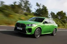 -m35i-xdrive-frozen-tampa-bay-green-driving-2248px.webp